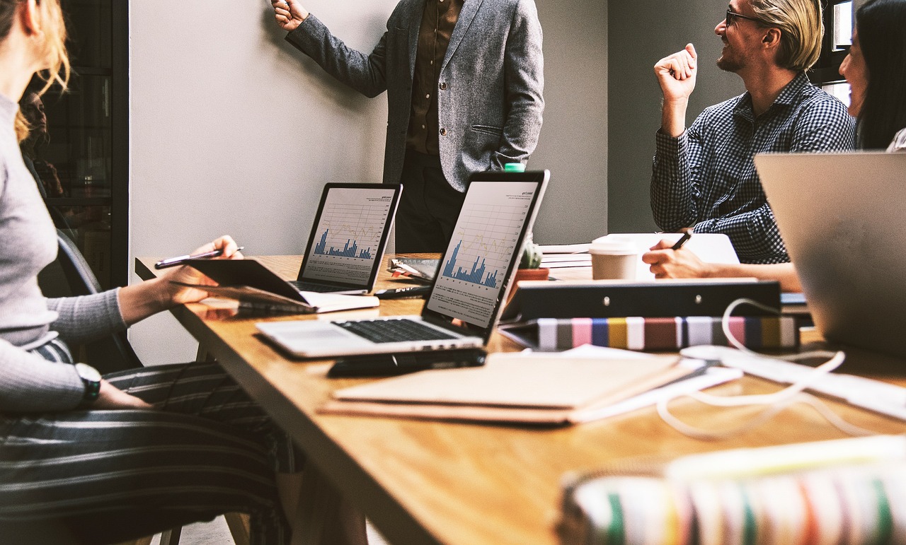 A diverse insurance team working together in a modern, naturally lit office